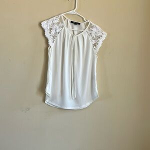 Beautiful top with Lace sleeves. Never worn